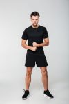Full length portrait of a concentrated young sportsman