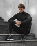 man-athletic-wear-posing-stairs-outdoors