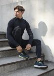 man-athletic-wear-posing-stairs-outdoors